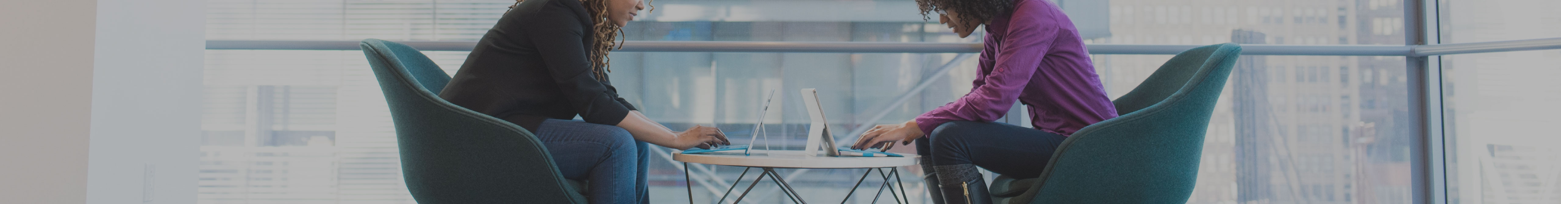 picture of two business women working at a table by protect commercial insurance