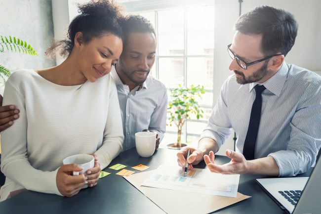 Image of a couple discussing their professional indemnity needs with an insurance broker