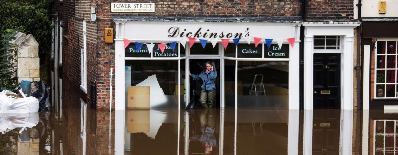 picture of a flooded hughstreet outside a shop for flood insurance by protect commercial