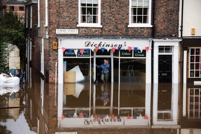 picture of a flooded hughstreet outside a shop for flood insurance by protect commercial